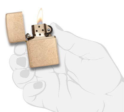 ArmorÂ® Tumbled Brass Windproof Lighter lit in hand