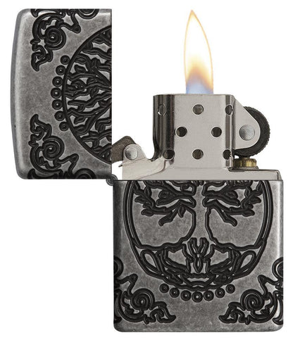 ArmorÂ® Tree of Life Windproof Lighter with its lid open and lit