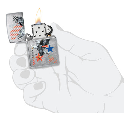 Zippo Abstract Americana Design Brushed Chrome Windproof Lighter lit in hand.