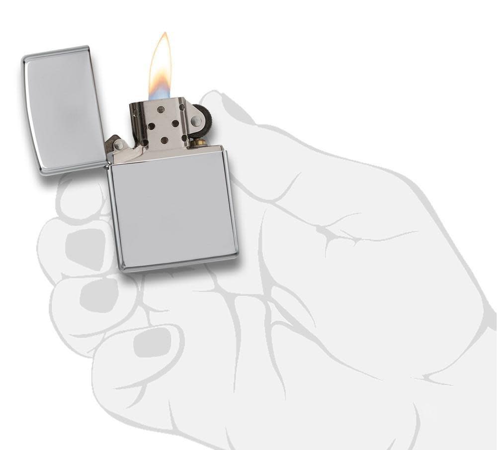 ArmorÂ® High Polish Chrome Windproof Lighter lit in hand