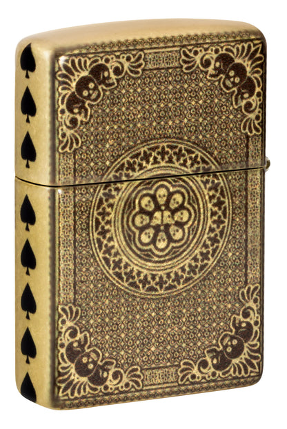 Back shot of Zippo Ace of Skulls Design 540 Tumbled Brass Windproof Lighter standing at a 3/4 angle.