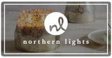 Northern Lights Candles logo with candles in background